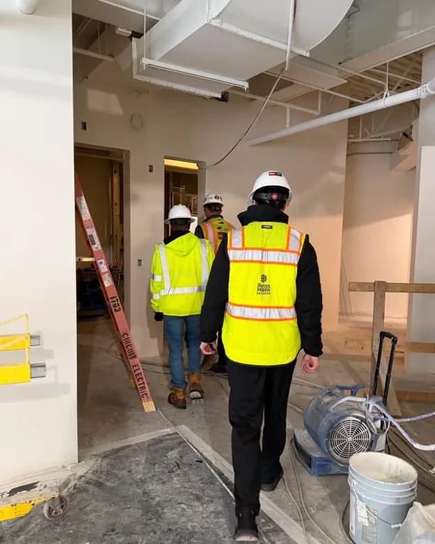 Occupants working in a modern office with full indoor cellular coverage